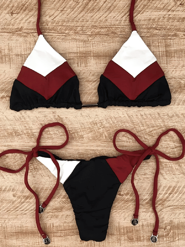Printed lace-up bikini with patchwork design, featuring a low-waisted style and integrated padding. Ideal for beach days.